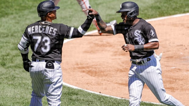 May 29, 2021; Chicago, Illinois, USA; Chicago White Sox shortstop Tim Anderson (7) celebrates with catcher Yermin Mercedes (73) after scoring against the Baltimore Orioles during the first inning of the first game of a doubleheader at Guaranteed Rate Field.